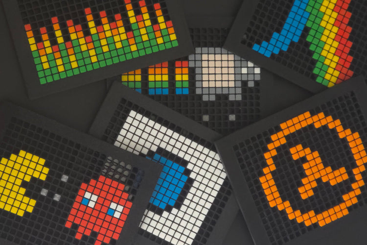 Multiple colourful BitPlate Steam Machine faceplates stacking on top of each other