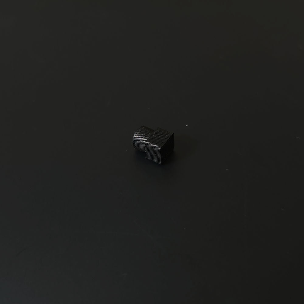 Small black base pin on a black background