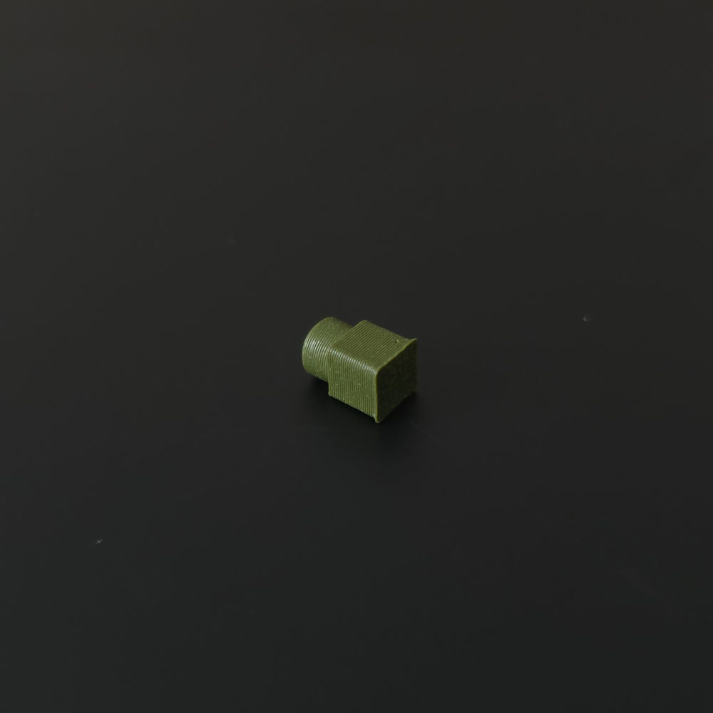 Small camo green pin on a black background