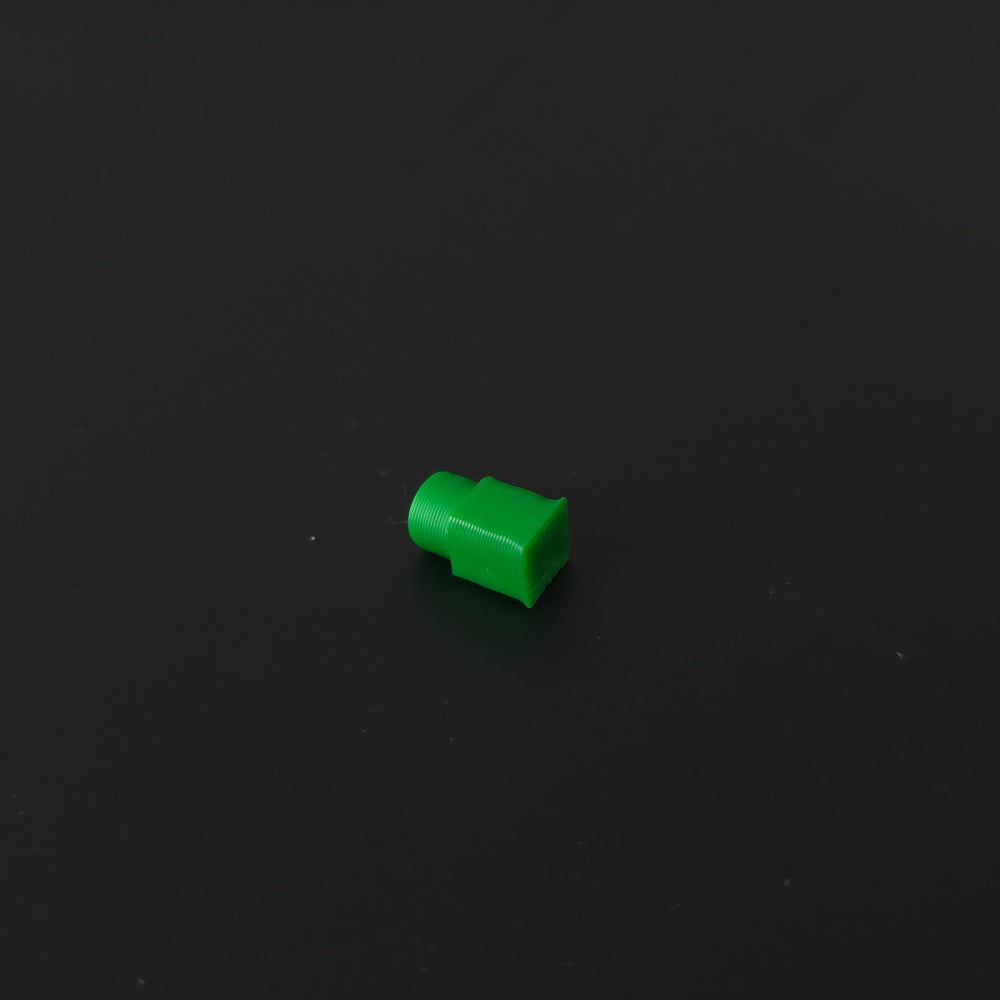 Small green pin on a black background