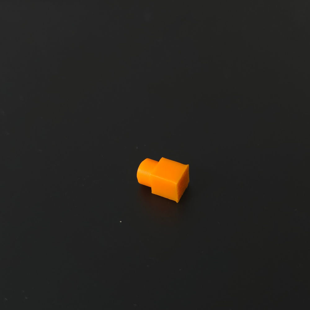 Small orange pin on a black background