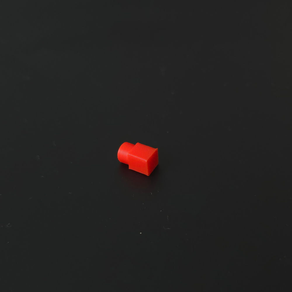 Small red pin on a black background