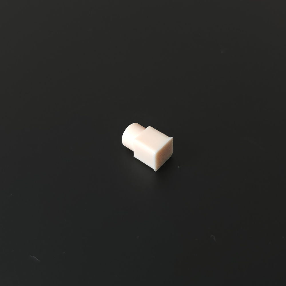 Small shell pink pin on a black background